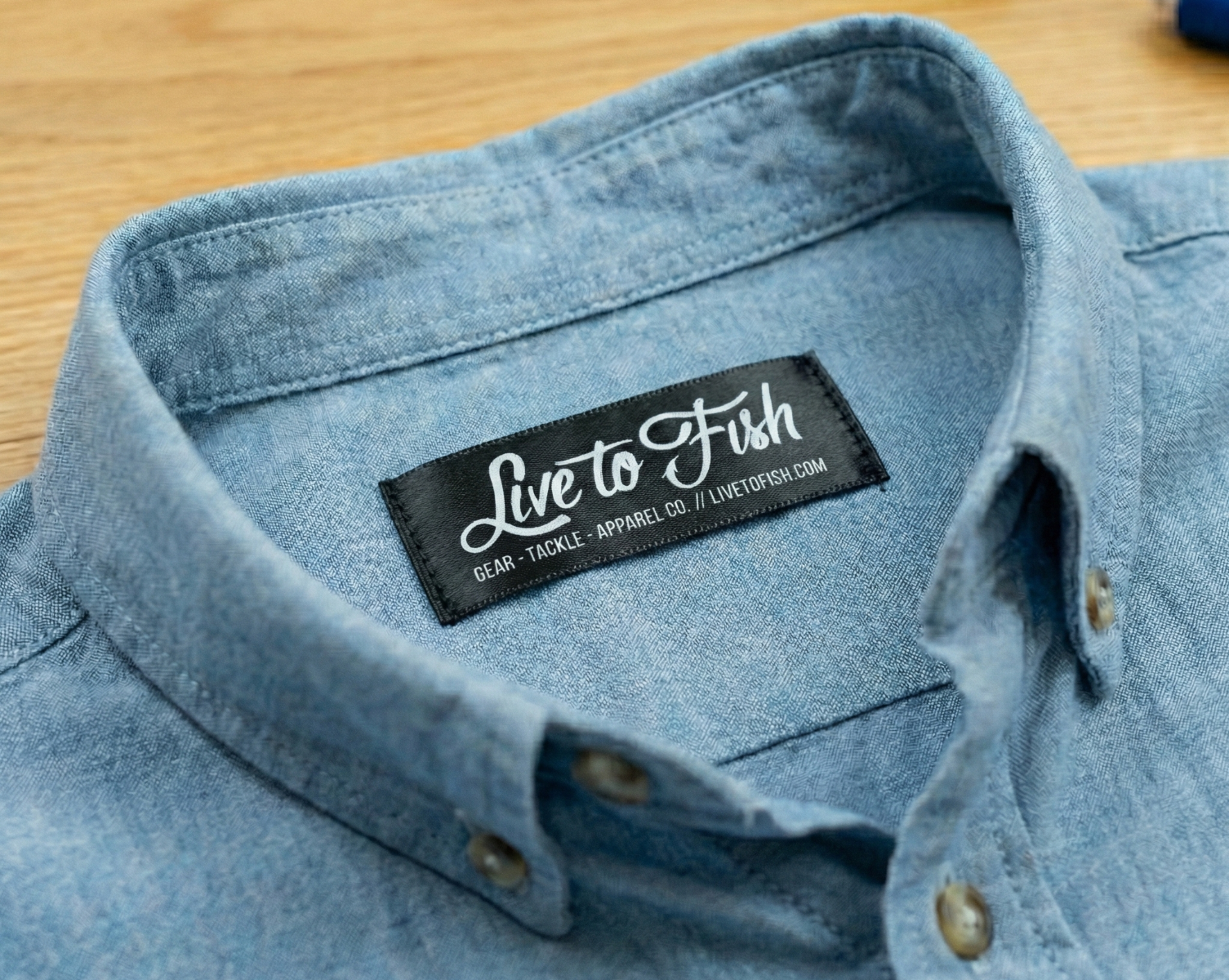 Printed satin care label sewn into garment neckline showing practical use